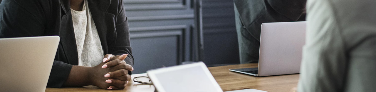 Woman sitting at desk in an interview