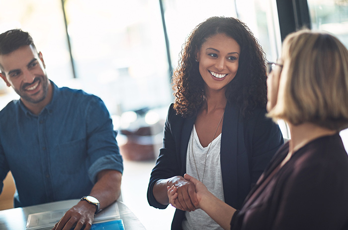 Image of Security Finance employee and customer shaking hands