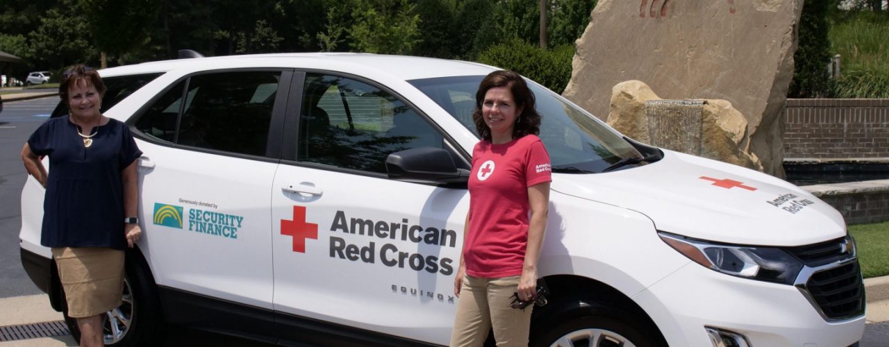 Ladies with the American Red Cross car
