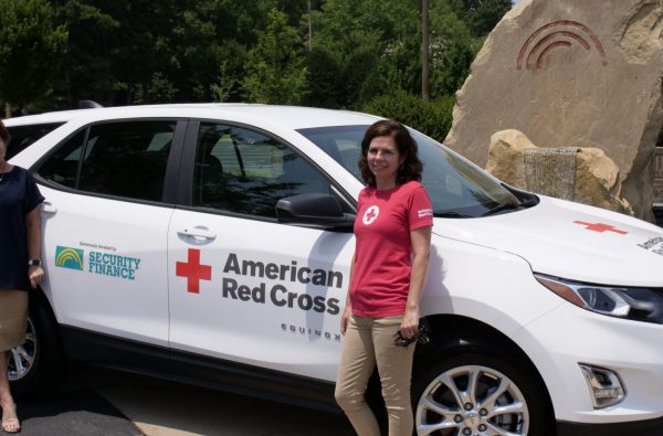 Ladies with the American Red Cross car