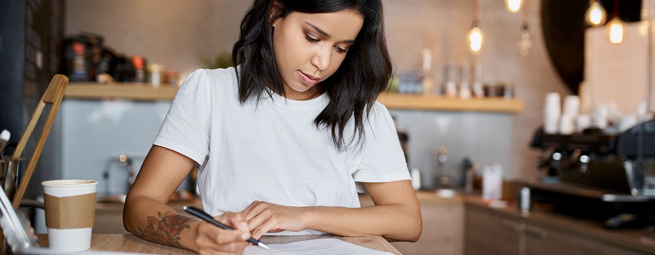 Young girl doing some paper work