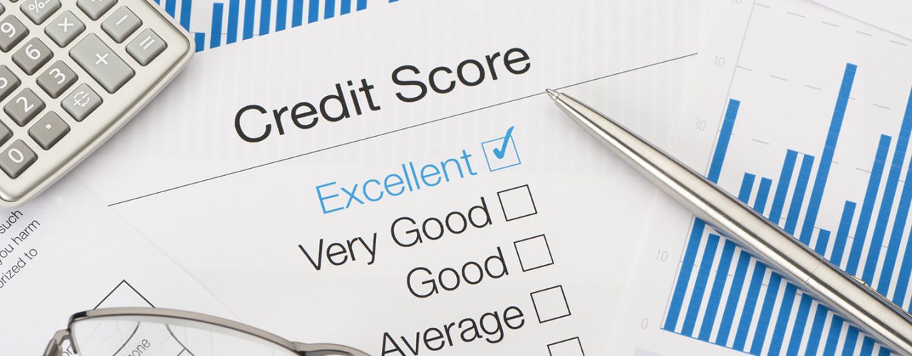 Excellent Credit Score with pen and calculator