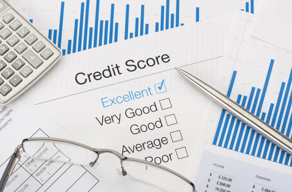 Excellent Credit Score with pen and calculator