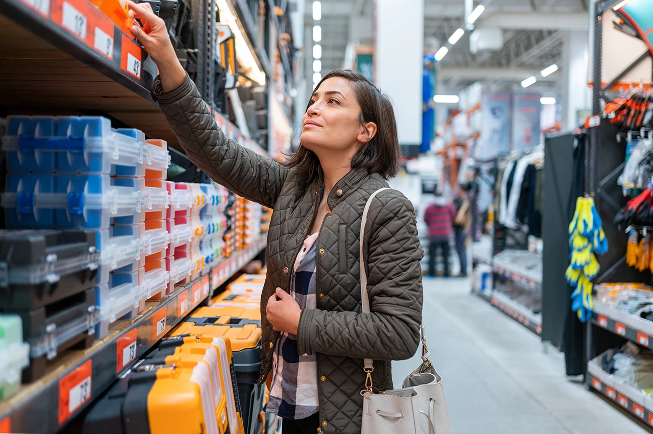 Woman Choosing Materials in Hardware Store
